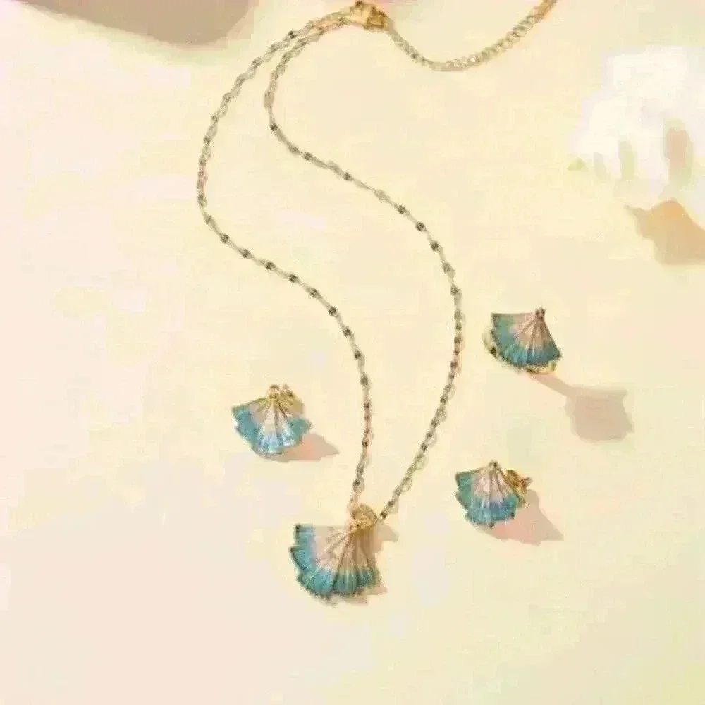 Delicate Fan-Shaped Pendant Accented with Shimmering Blue Hues